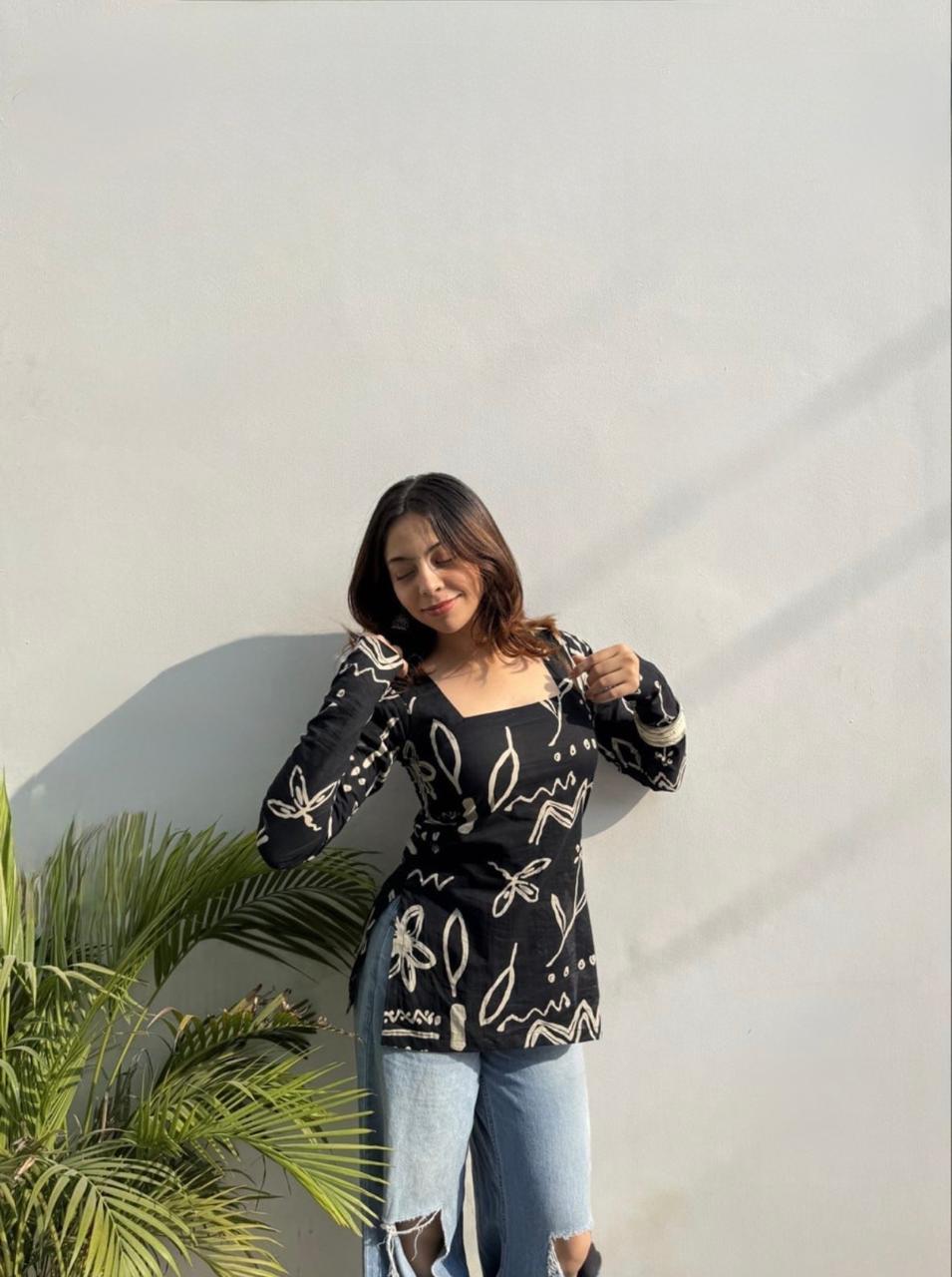 Black viscose rayon printed tunic featuring a square neckline